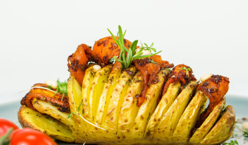 Hasselback potatoes with spicy carrot strips